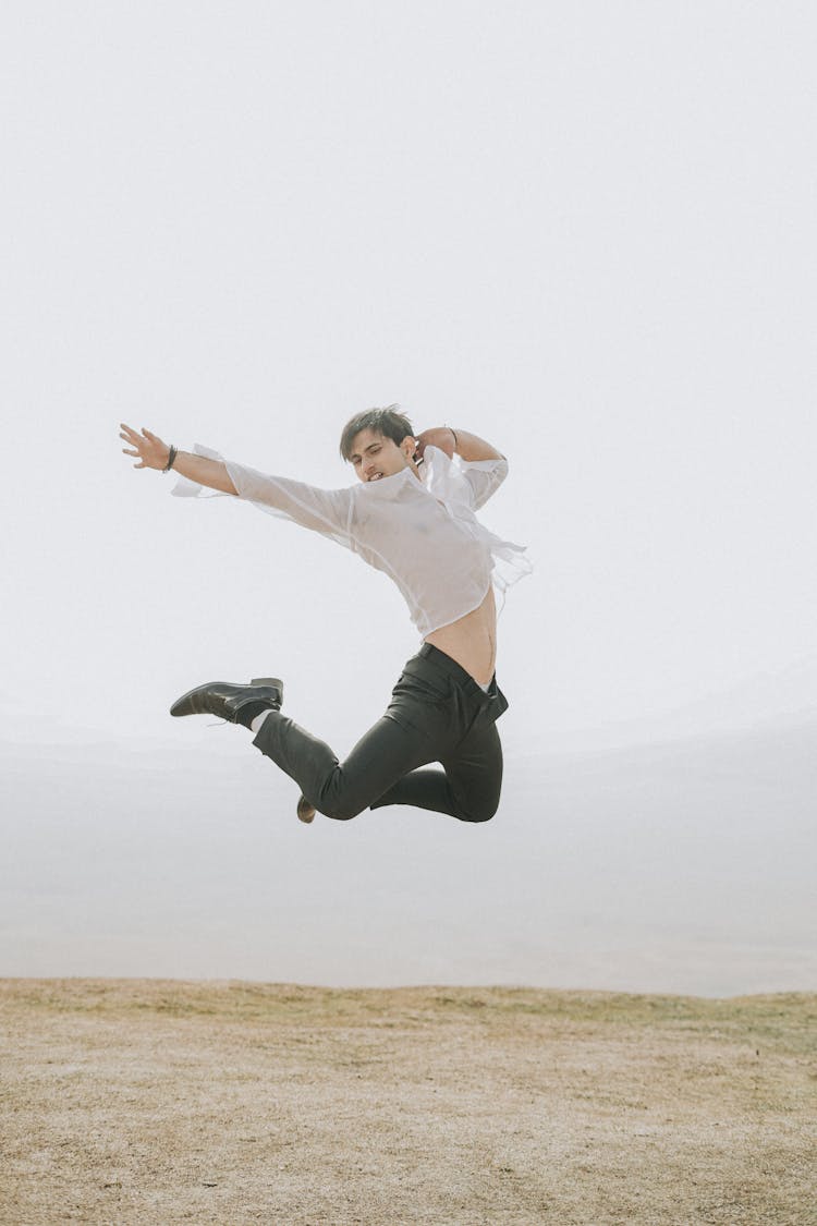 Man In Shirt Jumping High