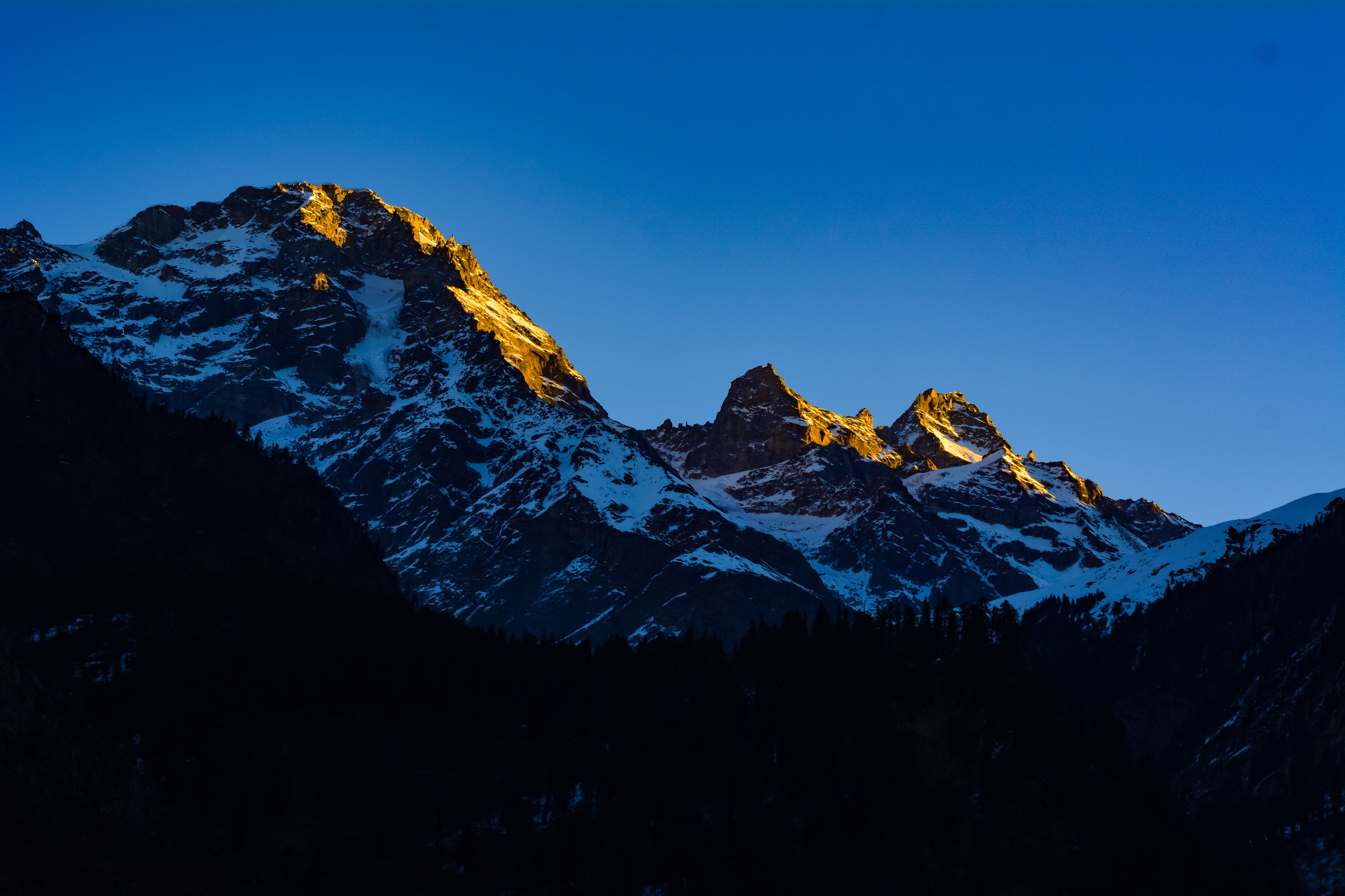 Snow Covered Mountains During Golden Hour · Free Stock Photo