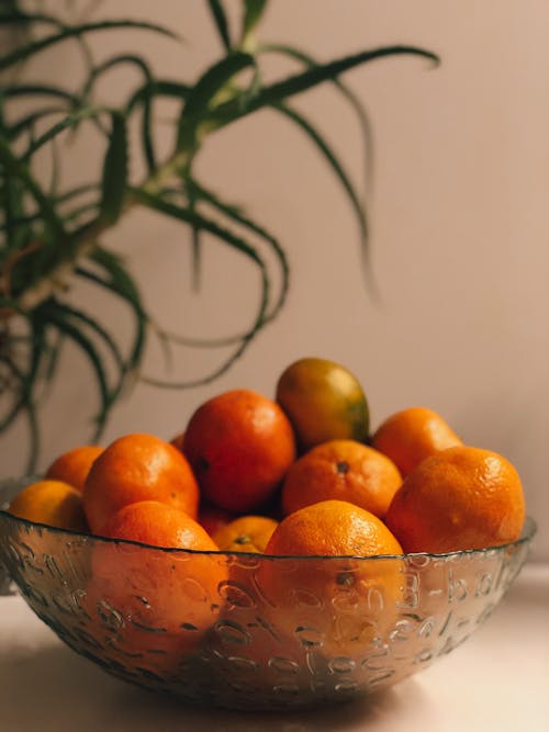 Oranges on a Glass Bowl