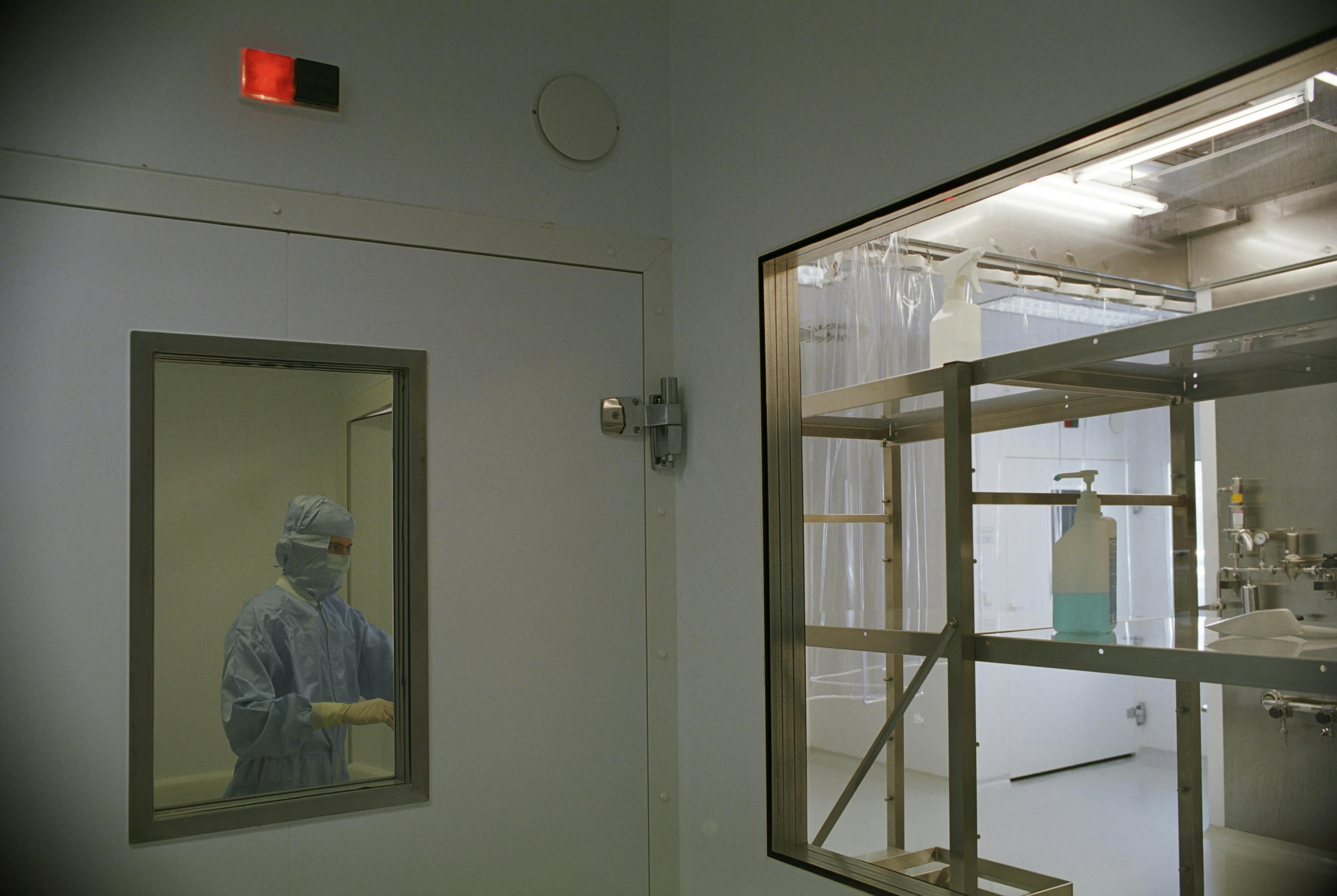 Image of a cleanroom in a medical facility featuring sterile equipment and a person in protective clothing. — What's New...