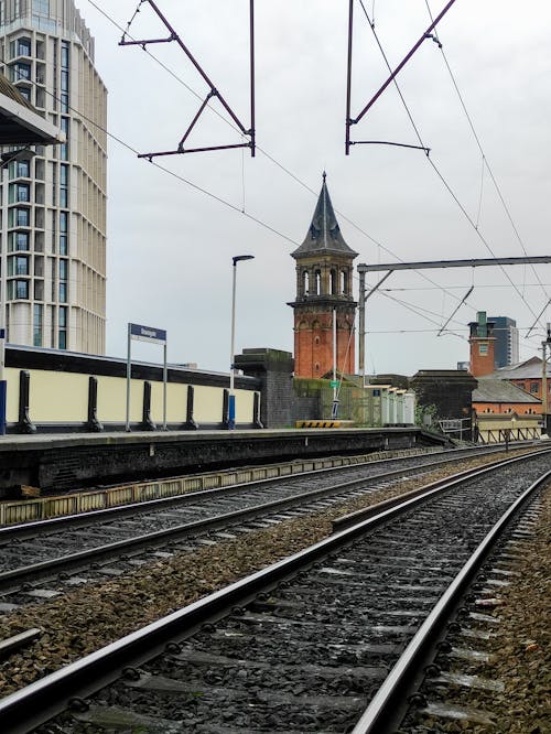 Photograph of a Tower Near Railway Tracks