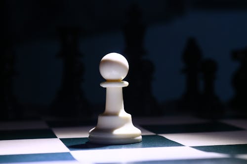 Close-Up Photo of a White Chess Piece