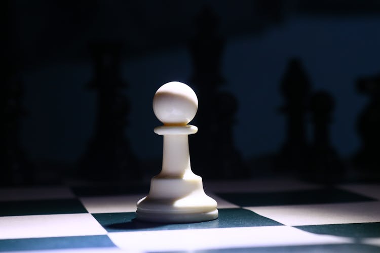 Close-Up Photo Of A White Chess Piece