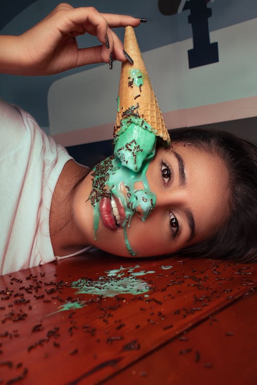 Free Dripping Ice cream on Woman's Face Stock Photo