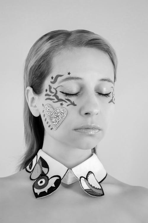 Monochrome Photo of a Woman with Face Paint