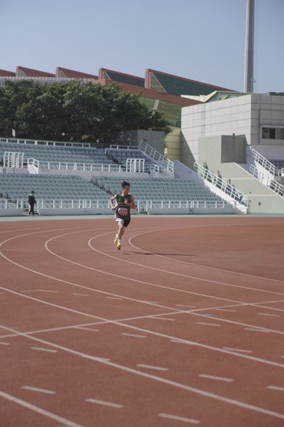 Athlete running on an outdoor track by Gary Chan on Pexels