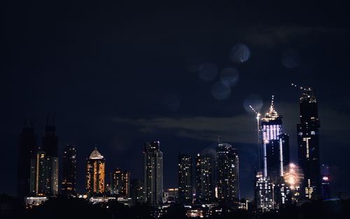 Free Stunning view of Jakarta's night skyline featuring illuminated skyscrapers and urban architecture. Stock Photo