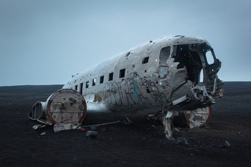 Free Explore the haunting wreckage of a DC-3 plane on Iceland's desolate black sands. Stock Photo
