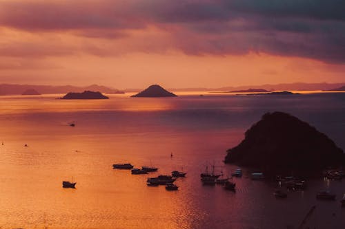 Watercrafts at Sea During Golden Hour