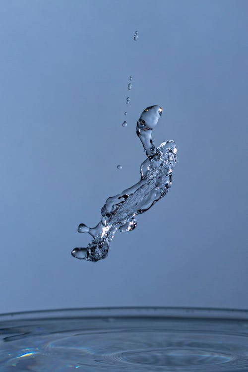 Free Waterdrops over a Basin Stock Photo