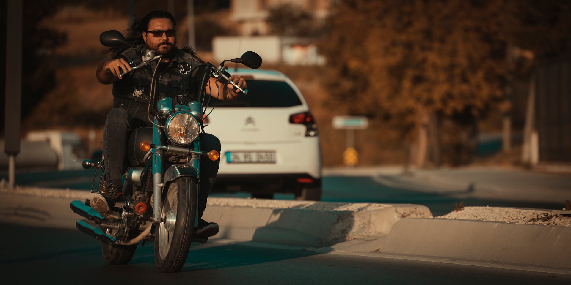 Biker on a motorcycle navigating the roads of Beylikdüzü, Istanbul on a sunny day.