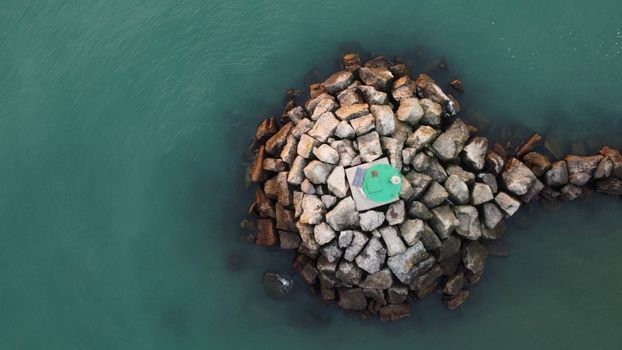 Gray and Brown Rocks on Body of Water