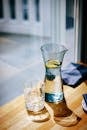 Carafe of Water and a Glass on a Table