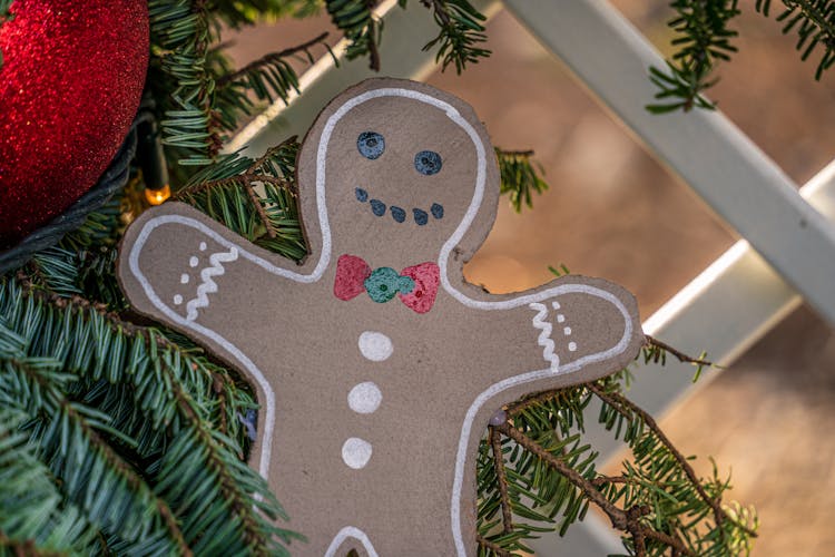 A Cardboard Ginger Man Cutout On A Christmas Tree