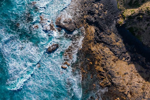 Drone Shot of Waves Crashing on Rocks