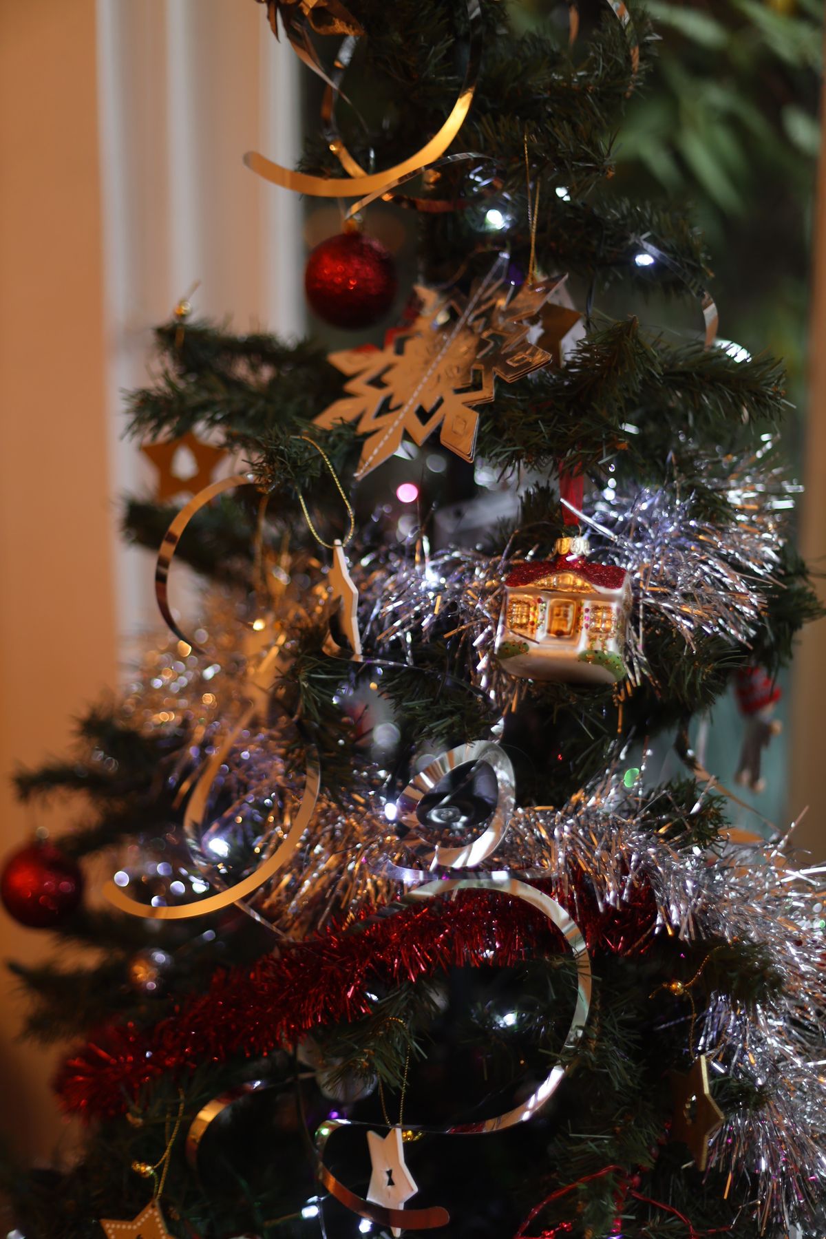 Christmas tree with ornaments and fine tinsel strands