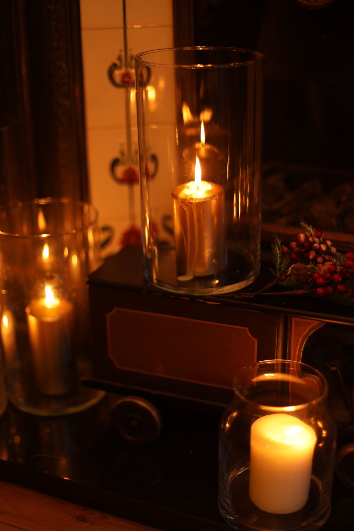 Unused fireplace filled with logs and flameless LED candles
