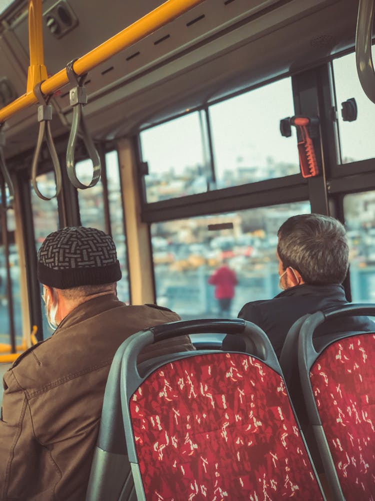 Men Sitting Inside The Bus