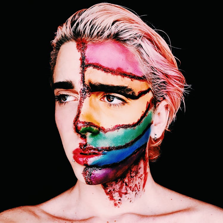 Person Wearing Artistic Makeup Depicting Scars And Rainbow Flag