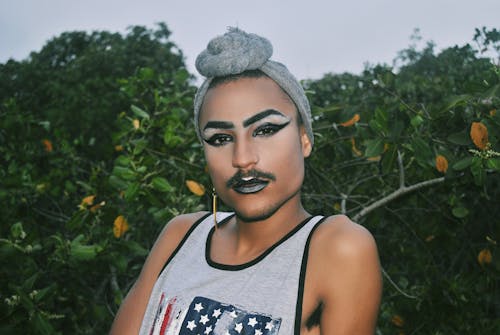 Man Wearing a Gray Head Wrap and Gray Tank Top