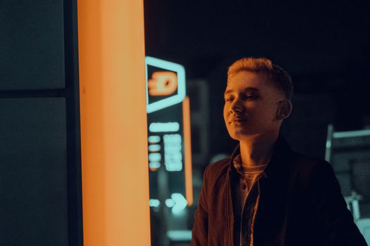Portrait of a young man under neon lights in Fethiye, Türkiye.