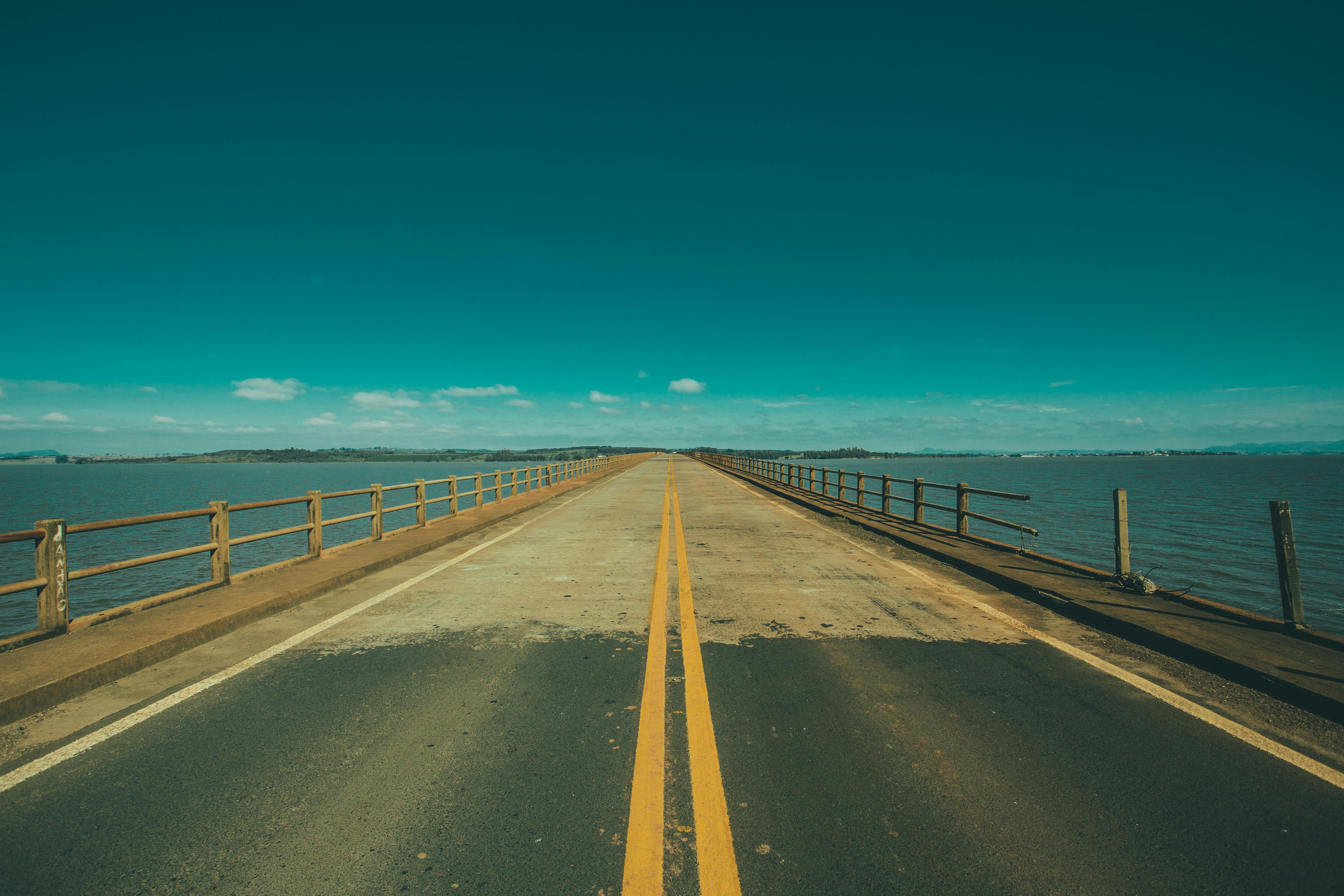 Grey Concrete Road In The Middle Of The Sea Free Stock Photo
