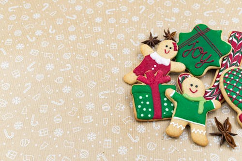 Gingerbread Cookies on a Pastel Colored Surface 