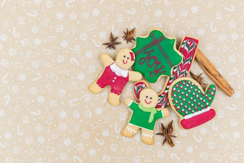 Gingerbread Cookies on a Pastel Colored Surface 