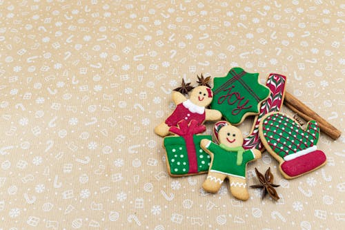 Gingerbread Cookies on a Pastel Colored Surface 