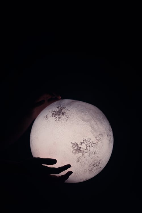 Silhouette of Hands and Full Moon