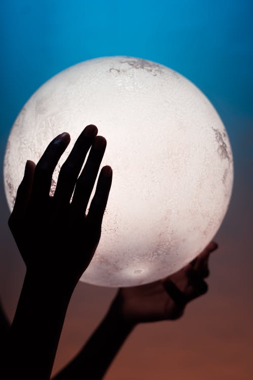 Free Hands Holding Full Moon Stock Photo