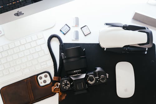 Black Dslr Camera on Top of Black Surface 