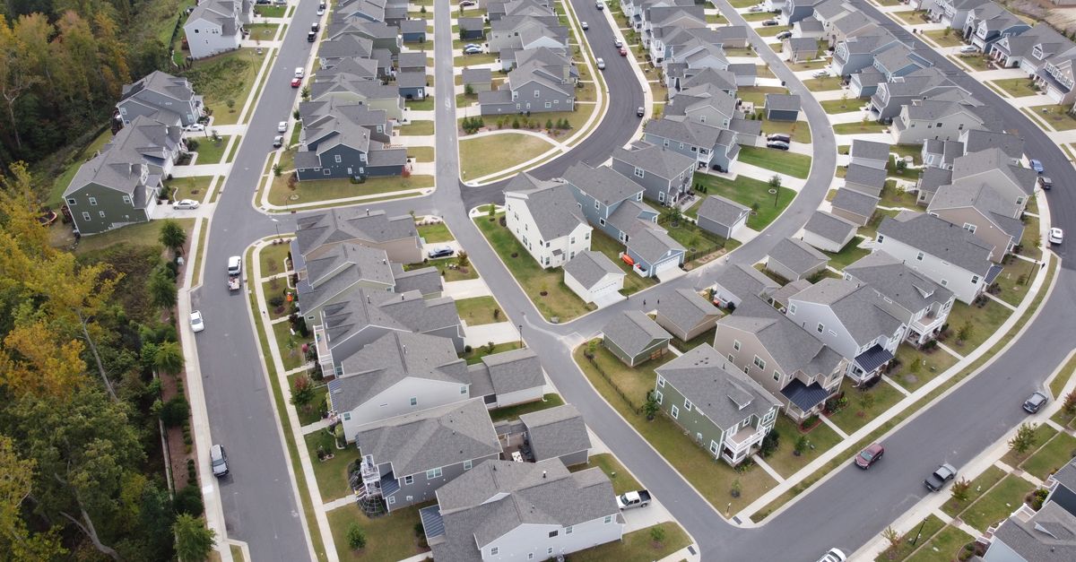 Drone shot of a modern residential area with houses and winding roads in Fort Mill, SC.