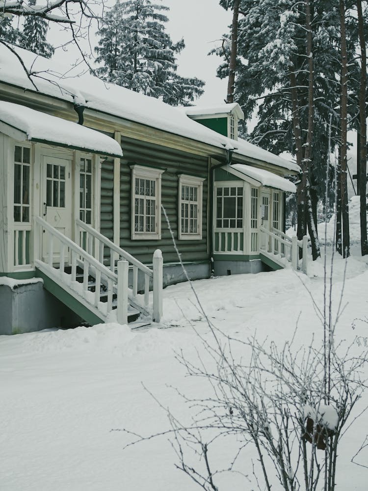 Roof Of A House Covered In Snow