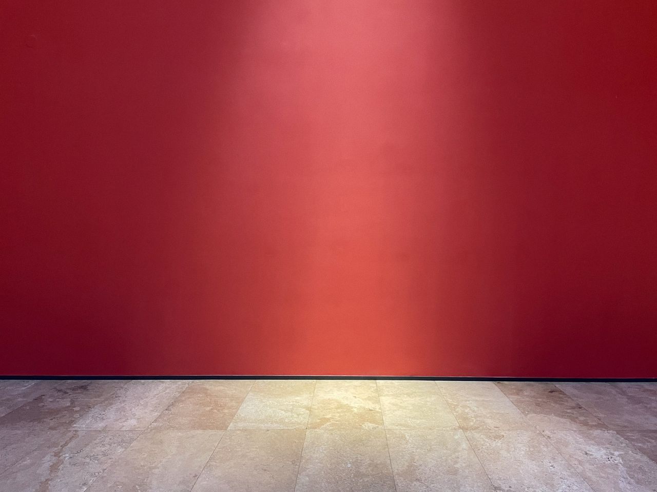bold red wall with a smooth marble floor perfect minimalistic backdrop