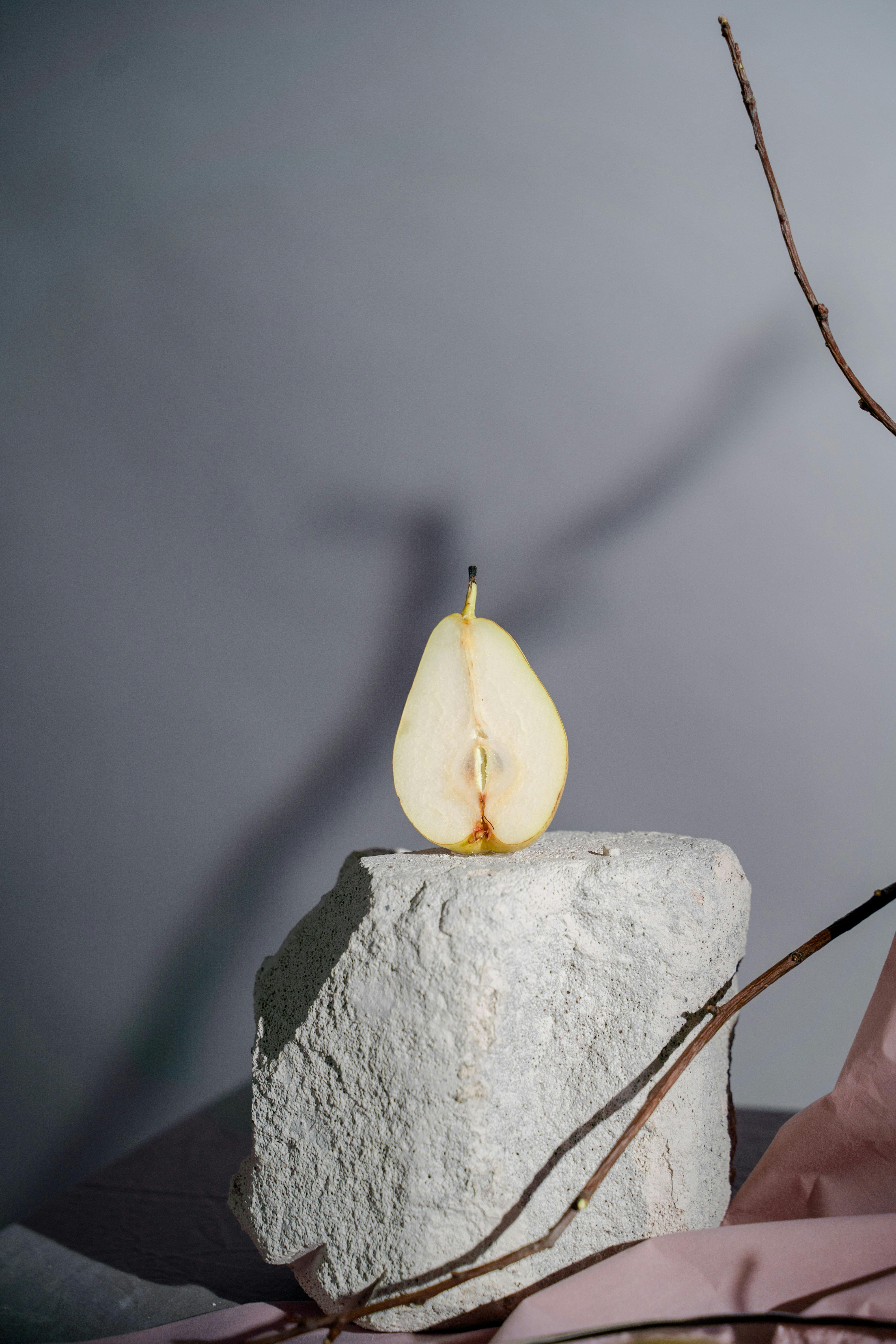 peach on rock on table