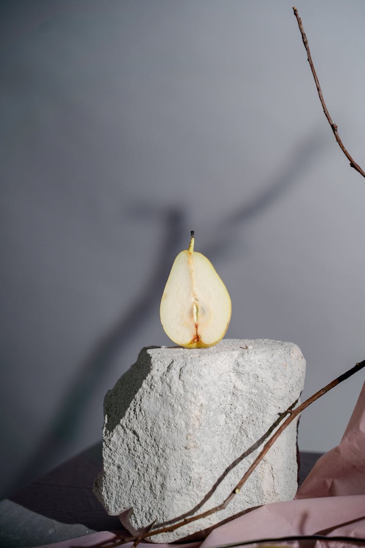 Peach On Rock On Table