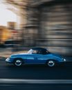 A Side Shot of a Retro Car in Motion