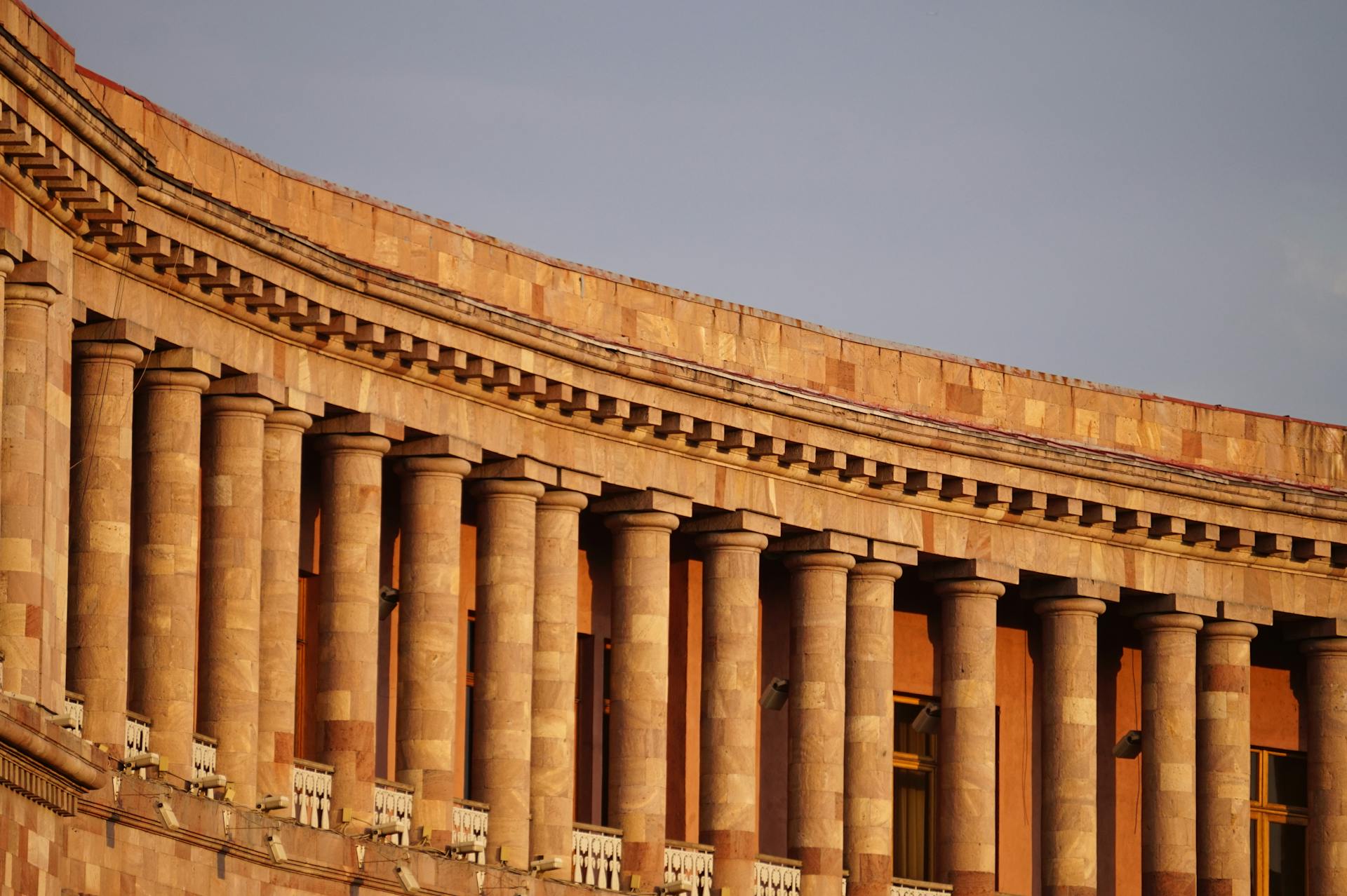 Majestic columns of a historic building in Yerevan, Armenia, showcasing traditional architecture.