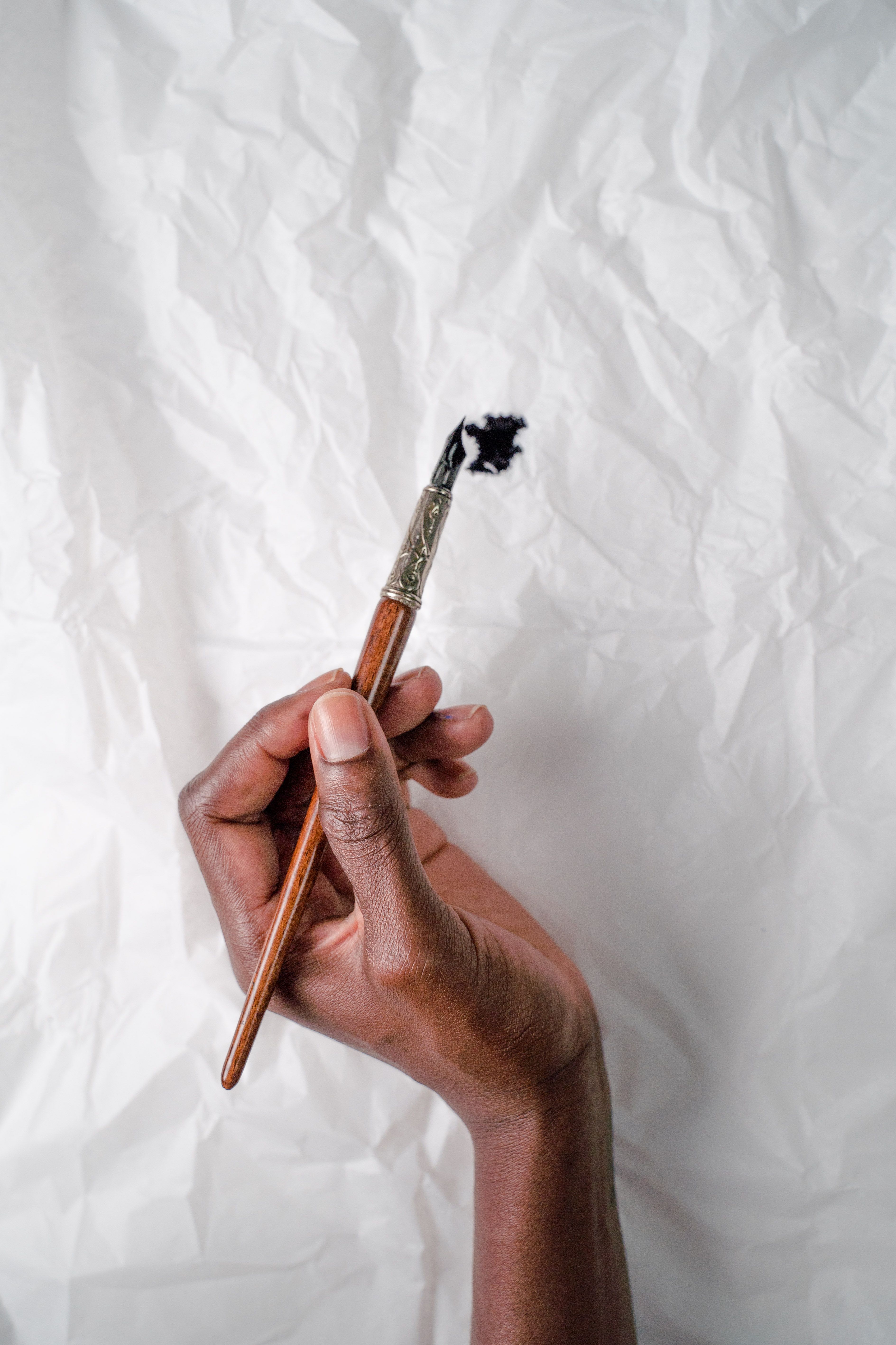 Pen over Ink Spot on Wrinkly Paper · Free Stock Photo