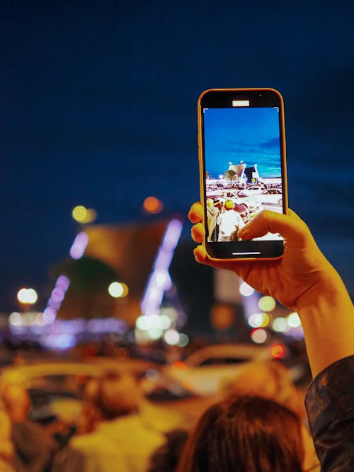 Person Smartphone Taking Photo during Night-Time