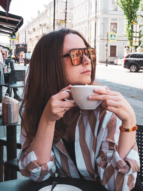 Stylish Woman holding Ceramic Cup 