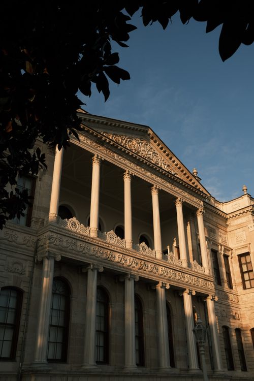 Free Elegant architecture with classical columns and intricate design in warm light. Stock Photo