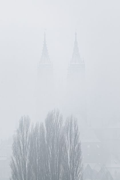 Gothic stone spires wrapped in fog, photo by Christopher Arnold on Pexels
