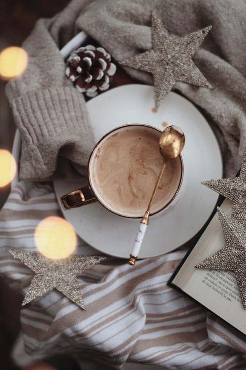 Free Coffee, Christmas Ornaments and Book Stock Photo
