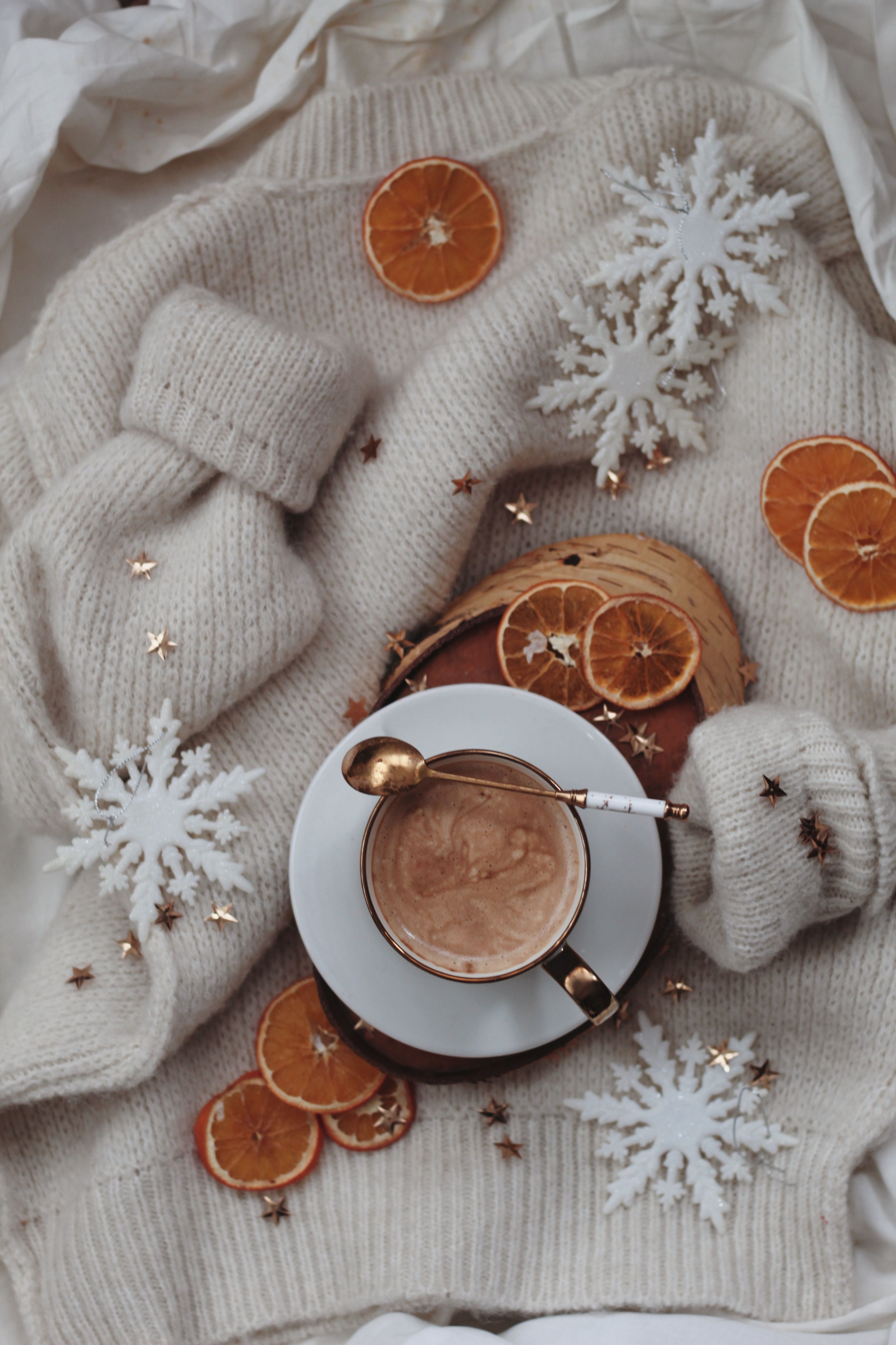 Free A warm, inviting flat lay of a sweater, coffee, and festive decorations for a cozy winter feel. Stock Photo