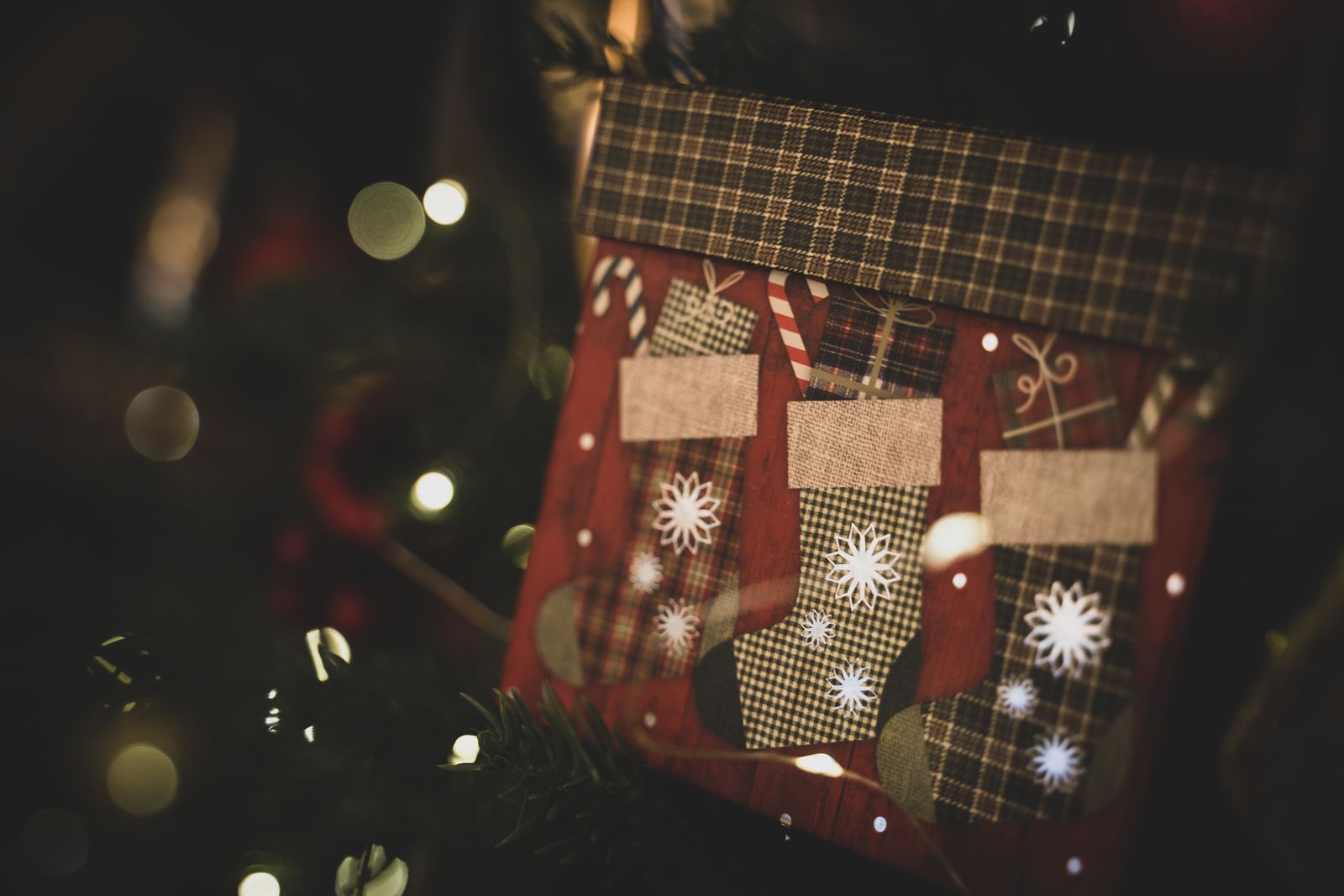 festive Christmas stockings with decorative lights, close-up