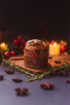 Delicious panettone with holiday decorations, captured in warm ambient lights.