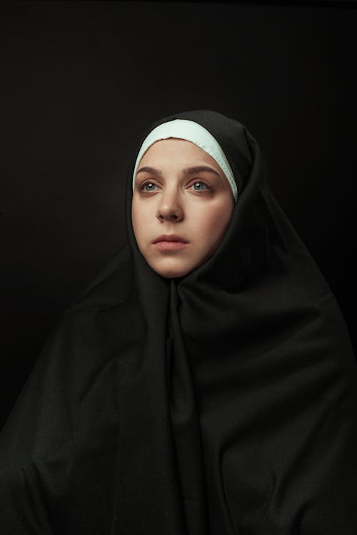 Woman in Black Headwear 