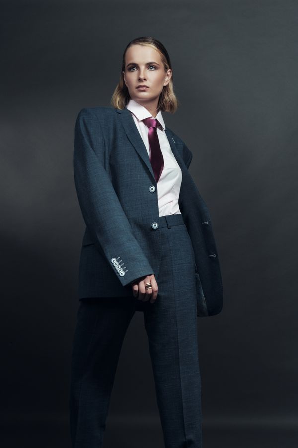 Woman wearing a ponte knit suit set for work travel